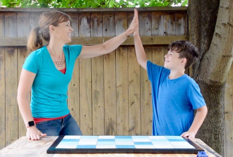 Theresa and Jack high five after finishing a Tile Doormat | Habitat ReStore | MyFixitUpLife