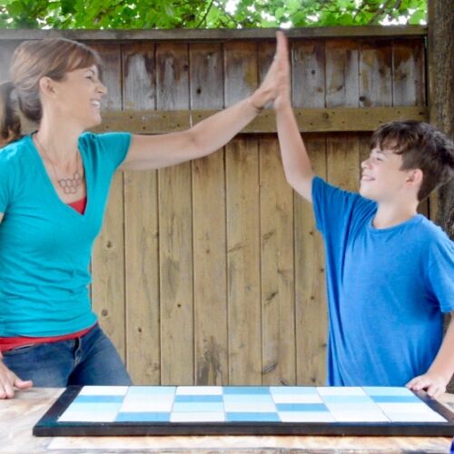 Theresa and Jack high five after finishing a Tile Doormat | Habitat ReStore | MyFixitUpLife