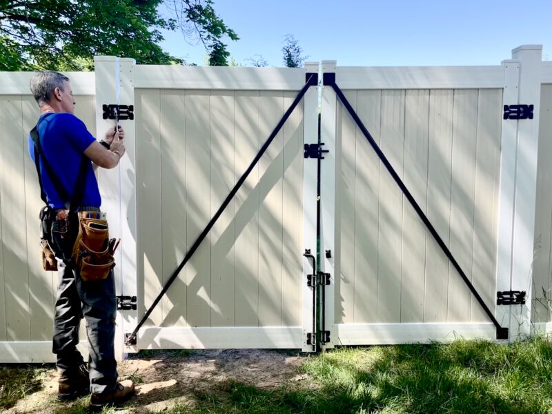 Mark fixes vinyl fence gate upper with adjustable wrench MyFixitUpLife