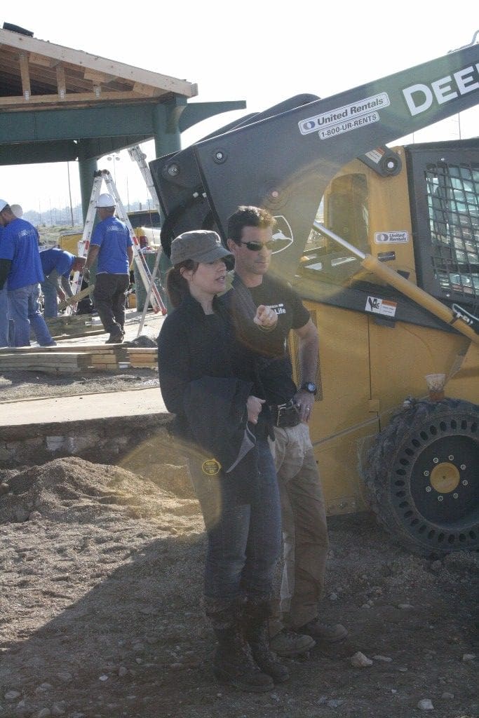 Theresa and Mark at Extreme Makeover Home Edition managing site work.