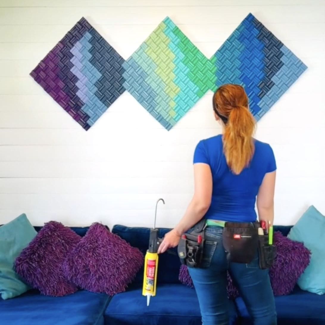 Theresa installing custom wall art Theresa installing custom wall art