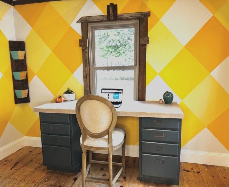 Desk made by Theresa How to Restyle a Room in 6 Easy Steps MyFixitUpLife MyFixitUpLife Desk with a laptop in a bright yellow diamond pattern room window above and blue gray drawers underneath the white desk surface Informative context MyFixitUpLife